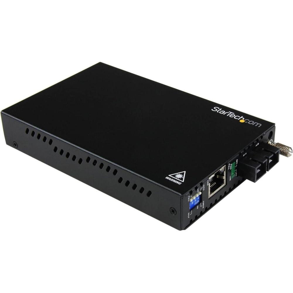 imageStarTechcom 10100 Mbps Multi Mode Fiber Media Converter SC  Up to 12 miles2km TAA ET90110SC21 x 35 x 59
